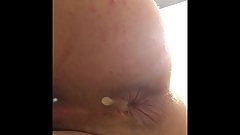 Twink slut shows cum filled ass