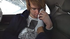 Receiving feetjob on car parking