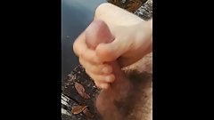 I jerk my hard cock and blow my load out in the woods