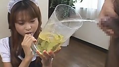 Japanese maid drinks piss from a directely filled funnel