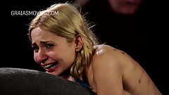 Little blonde whore caned while chained down