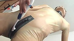 latex girl playing with toothbrush